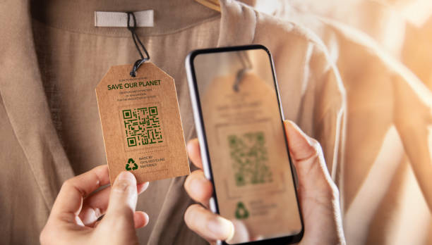 Recycling Products Concept. Organic Cotton Recycled Cloth. Zero Waste Materials. Environment Care, Reuse, Renewable for Sustainable Lifestyle. Using Mobile Phone to Scan on Tag for more Information